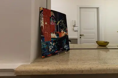 a painting sitting on a counter in a room at RANALLI Suite in Rome