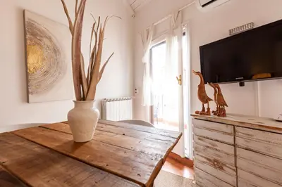 a living room with a vase on a wooden table at Pantheon Splendid Flat with Terrace in Rome