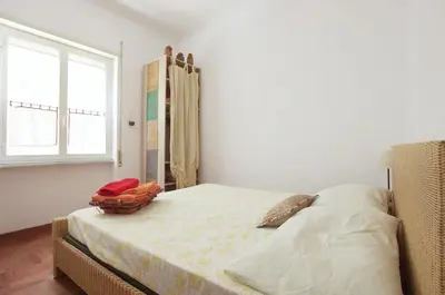 a bedroom with a bed and a window at La Casa dei Quattro Venti in Rome