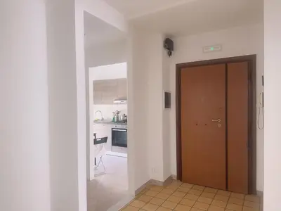 a hallway with a door leading to a kitchen at Lisa HOUSE in Rome