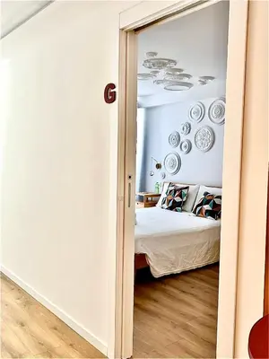 a bedroom with a bed and plates on the wall at EppyTime Roma in Rome