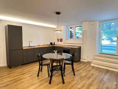 a kitchen and dining room with a table and chairs at EppyTime Roma in Rome