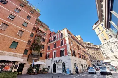 a group of buildings on a city street at Leonina Terrace - My Extra Home in Rome