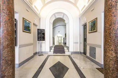 a hallway with a staircase in a building at Opera Theater Relais in Rome