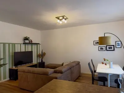 a living room with a couch and a table at Appartamento con vista Vaticano in Rome