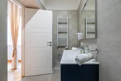 a bathroom with a sink and a mirror at Angela luxury home,Premium Apartment for families in Rome