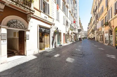 an empty street in a city with buildings at Amazing Piazza di Spagna in Rome