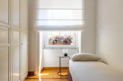 a bedroom with a bed and a window at Adriana Star luxury large and central in Rome