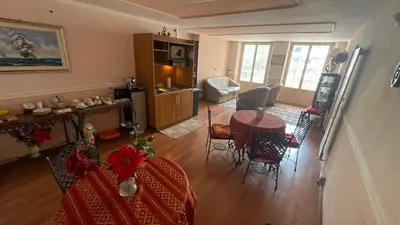 an aerial view of a living room and dining room at La Villa di Roma in Rome