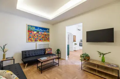 a living room with a couch and a flat screen tv at iFlat Vatican Elegant and Spacious Apartment in Rome
