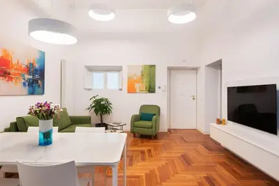 a bathroom with a sink and a mirror at Idyllia - Vatican Stylish Flat in Rome