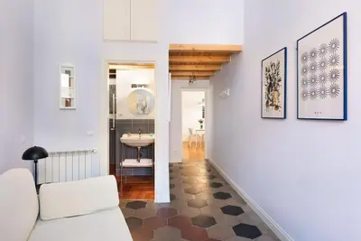 a living room with a couch and a sink at Idyllia - Vatican Stylish Flat in Rome