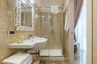 a bathroom with a sink and a shower at Le Chiavi di Roma in Rome
