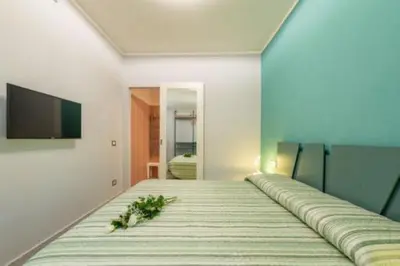 a bedroom with a bed with flowers on it at Heavenly Trevi Luxury Apartment in Rome