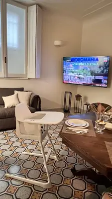 a living room with a couch and a table at 3Bdr Apartment in the heart of Rome in Rome