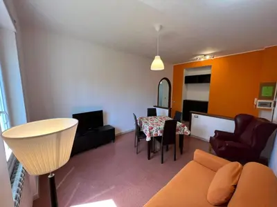 a living room with a couch and a table at Alla Pineta in Rome