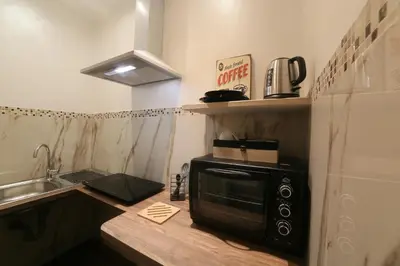 a microwave sitting on a counter in a kitchen at I Quattro Elementi Roma in Rome