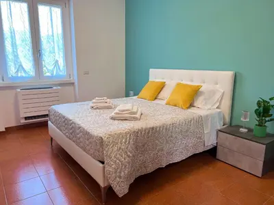 a bedroom with a bed with towels on it at Dasy Apartment - San Paolo in Rome
