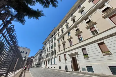 a large white building on a city street at Appartamento 