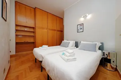 two beds sitting next to each other in a room at Appartamento 