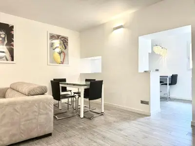 a living room with a table and a couch at Mercede Apartment - Spanish Steps in Rome