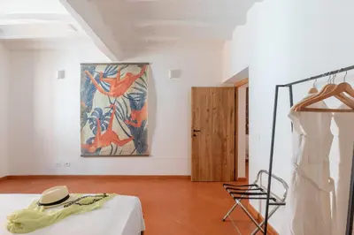 a room with a bed and a painting on the wall at iFlat Peaceful brand new 2beds apt in Trastevere in Rome