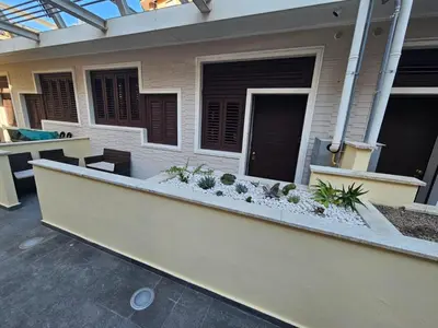 a porch of a house with plants on it at Trastevere golden luxury loft in Rome