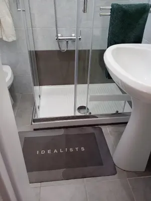 a bathroom with a shower with a sign that reads disabled at Nice house in Roma Esquilino Colosseum in Rome