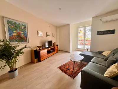 a living room with a couch and a tv at Sunshine Eco Residence in Rome
