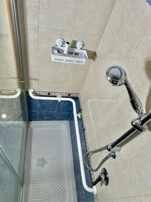 a shower with two rolls of toilet paper in a bathroom at Home Fermi 80 in Rome
