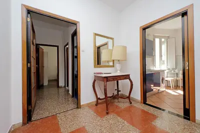 a room with a table and a mirror at Flaminio in Rome