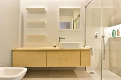 a bathroom with a sink and a shower at Oasi Piceni Apartment San Lorenzo in Rome