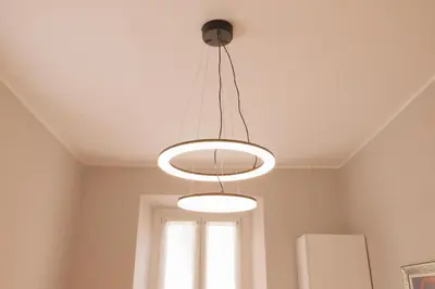 a ceiling light in a room with a window at Rome Flat 42 by GHOR in Rome