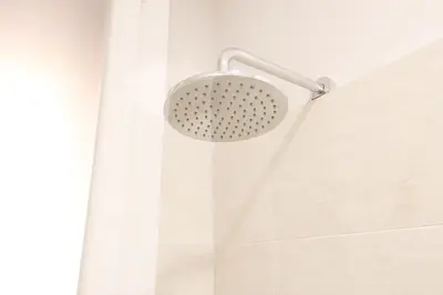 a shower with a shower head and a shower curtain at Rome Flat 42 by GHOR in Rome