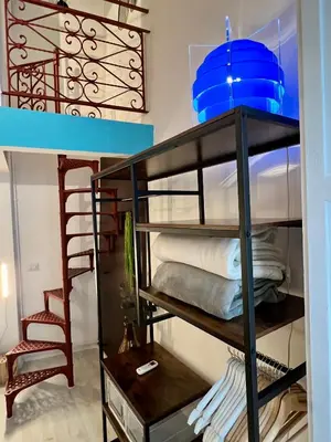 a room with a bunk bed with a ladder at Charming Navona - The Loft in Rome