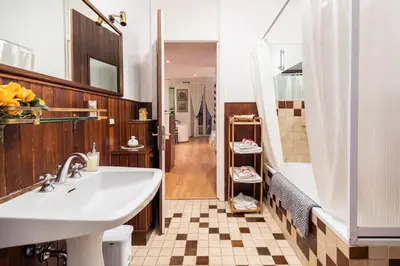 a bathroom with a sink and a shower at Appartamento elegante Castel Sant'Angelo in Rome
