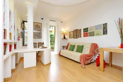 a living room with a couch and a table and a desk at Appartamento elegante Castel Sant'Angelo in Rome