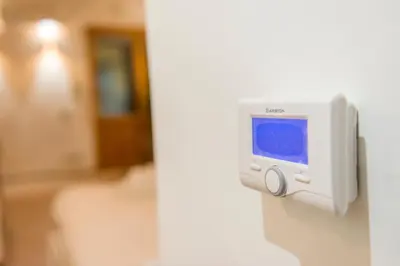 a computer monitor on a wall in a room at Appartamento via di Montegiordano in Rome