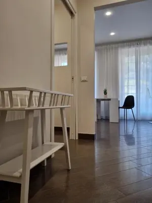 a room with a table and a desk and a chair at Relais Viola at the Vatican in Rome