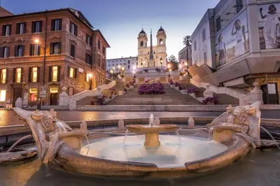 a fountain in the middle of a city with buildings at Little gem in Trevi Fountain in Rome