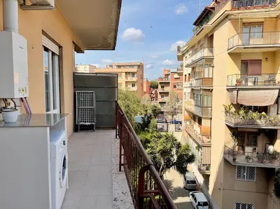 an apartment balcony with a view of a city at Casa Fernanda in Rome