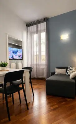 a living room with a bed and a table at Apartment Cerri 2 in Rome