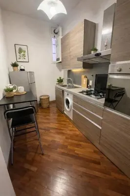 a small kitchen with a table and a stove at Apartment Cerri 2 in Rome