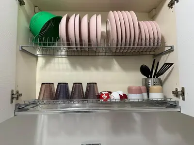 a kitchen shelf with plates and utensils at Apartment Cerri 2 in Rome