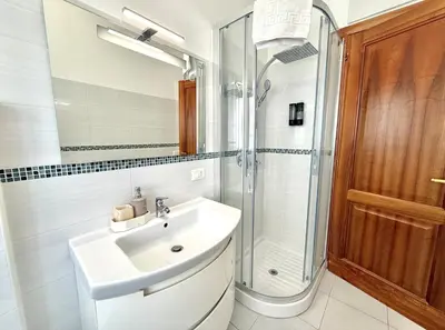 a bathroom with a sink and a shower at 10 minuti da stazione Trastevere in Rome