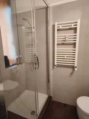 a bathroom with a shower and a toilet at Roma Eur - OrangeVibes Loft in Rome