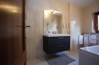 a bathroom with a sink and a mirror at Magenta Luxury Purificazione in Rome