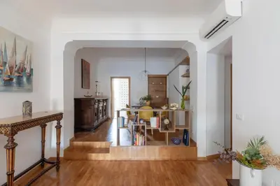 a living room with a table and a dining room at iFlat Pantheon Peaceful & Comfortable Apartment in Rome