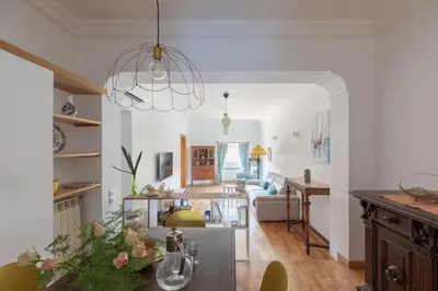 a living room and dining room with a dining table at iFlat Pantheon Peaceful & Comfortable Apartment in Rome