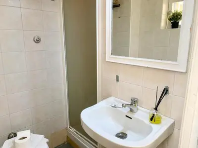 a bathroom with a sink and a mirror at DaliTourism - Vatican Apartment 118 in Rome